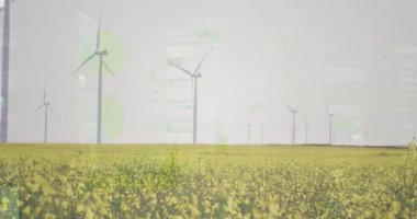 Rüzgâr türbinleri düz dizayn UI kaplamalı kanola alanının üzerinde dönüyor. Yenilenebilir enerji, sürdürülebilirlik, tarım, manzara, teknoloji, yenilik, çevre