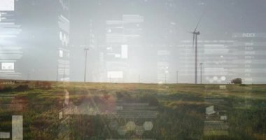 Rüzgâr türbinleri, saydam çizelgeler, grafikler ve veri panelleriyle çimenli düzlüklerde izlenmektedir. Yenilenebilir, sürdürülebilirlik, teknoloji, manzara, yeşil enerji, yenilik, çevre