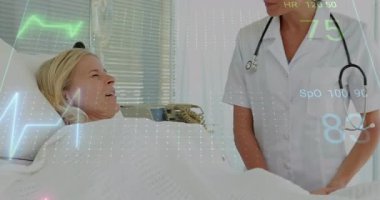 Hastanedeki hemşireyle konuşan hasta, hayati belirtileri gösteren grafikler gösteriyor. Tıbbi, sağlık, klinik, terapötik, tanı, hasta bakımı, hastane ayarları