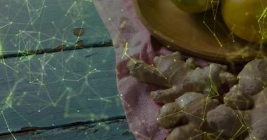 Dijital ağ altında taze zencefil kökleri ve limonları gösteren mutfak masasını görselleştirmek. Kırsal, organik, canlı, aşçı, doğal, sağlık, zanaatkar