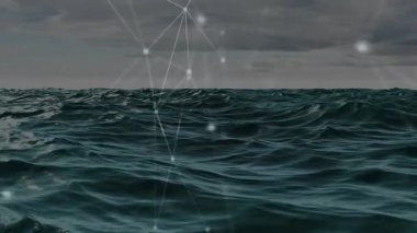 Parlayan ağ ızgaralarından geçen okyanus dalgaları birbirine bağlı düğümleri göstererek üç boyutlu görüntüler oluşturur. Gelecek, teknoloji, dijital, soyut, okyanus, ağ, bağlantı