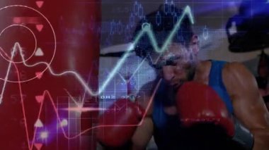 Erkek boksör spor salonunda ağır kum torbasına vuruyor. Finansal çizelgeler ve rakamsal veri örtüsüyle. Sporcu, fitness, dinamik, enerjik, modern, sağlık, güç