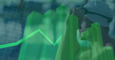 VR kulaklık takan adam teknoloji verileriyle etkileşime geçiyor, yeşil çizelgeler ve çizgi grafikleri gösteriyor. Teknoloji, analitik, yenilik, fütüristik, sürükleyici, veri görselleştirme, dijital arayüz