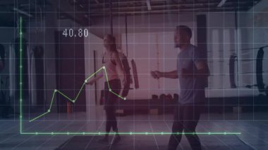 Parlak fitness stüdyosunda ip atlayan iki sporcu yeşil çizgi çizelgesi sergiliyorlar. Spor, güç, kardiyo, eğitim, dayanıklılık, motivasyon, sağlık