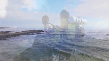 Animasyon kalp atış hızı grafikleriyle okyanus kıyısındaki kayalıkları keşfeden yürüyüş partnerleri. Macera, keşif, vahşi doğa, engebeli, açık hava, manzara, takım çalışması