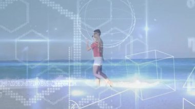 Erkek, elinde akıllı telefon tutan kadının yanında çıplak ayakla yürüyor. Teknolojik büyü çizgileri, parlayan çizgiler, kod gösteriyor. Dijital arayüz, artırılmış gerçeklik, geleceksel tasarım, plaj eğlencesi, teknoloji entegrasyonu, günlük yaşam tarzı, doğa düzenlemesi.