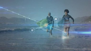 Sörf yapan erkek ve kadın sörfçü teknoloji pazarlama için düğüm gösteriyorlar. Macera, spor, açık hava, dinamik, enerjik, yoldaşlık, yenilikçi