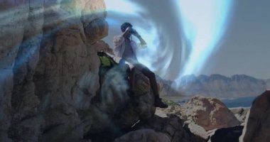 Kıyı uçurumunda dürbünle oturan bir adam etrafındaki animasyon teknolojisi portalını keşfediyor. Macera, keşif, vahşi doğa, dijital, hareket, manzara, yenilik