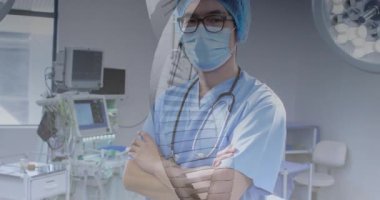 Cerrahi süitte duran erkek doktor animasyon tıbbi veri grafiği ve stetoskop ikonu gösteriyor. Tıbbi, sağlık, klinik, kesinlik, tanı, steril, profesyonel