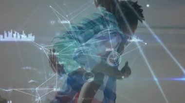 Baba, oğlunu animasyon teknolojili düğümlerle, çizgilerle ve veri tablolarıyla sahil şeridinde gezdiriyor. Aile, teknoloji, bağlantı, veri, açık hava, yenilik, eğitim