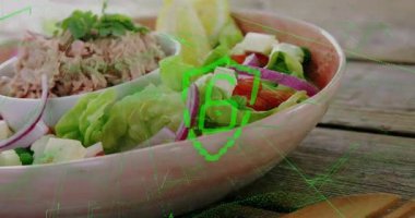 Masanın üzerinde yüzen ton balığı salatası kasesi yeşil kalkan kaplamasını ve ızgarayı 3 boyutlu olarak gösteriyor. Sağlıklı, beslenme, organik, kırsal, canlı, tazelik, mutfak