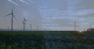 Ufuk boyunca dönen rüzgar türbinleri düz tasarımda çimenli düzlüklerde arıza çizgileri oluşturur. Yenilenebilir enerji, sürdürülebilir doğa, teknoloji, çevre, fütüristik, soyut