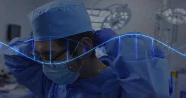Erkek cerrah ameliyathanede maske ayarlıyor, yüzen DNA sarmalı ile sağlık teknolojisi sergiliyor. Tıbbi, sağlık, yenilik, temiz, profesyonel, yüksek teknoloji, klinik