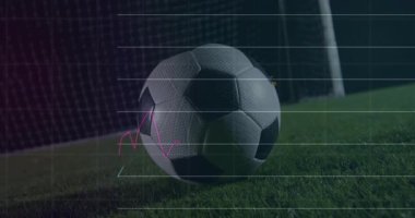 Futbol topu su basmış çimenlerin üzerinde dinleniyor, spor analitik çizgisi grafikleri ve bar çizelgeleri sergiliyor. Atletizm, stadyum, teknoloji, performans, açık hava, rekabet, fitness