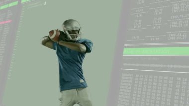 Oyun kurucu atölyeye futbol topu atıyor. Şifreleme grafikleri ve kaydırma kodları var. Sporcu, dijital, teknoloji, siber güvenlik, spor, yenilik, rekabet