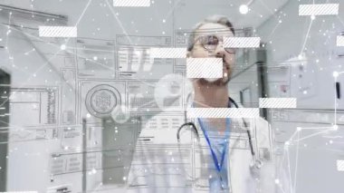 Doktor hastane koridorundaki tıbbi arayüzle etkileşime geçip şebekeleri ve şebekeleri açığa çıkarıyor. Teknoloji, sağlık, yenilik, tanı, teletıp, veri görselleştirme, profesyonel