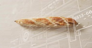 Hafif ahşap masa üstünde sergilenen kabuklu baget, teknik şematik örtüler içeriyor. Esnaf, fırın, ekmek, minimalizm, teknoloji, şema, dijital