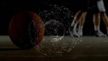 Sert ahşap sahada basketbol oynanan spor analitikleri, oyuncuların arkasında dijital düğüm çizgisi yer alıyor. Atletik, rekabetçi, yüksek teknoloji, dinamik, fitness, motivasyon, strateji