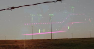 Günbatımı düşüşü türbin üzerinde veri örtüşmesi, şamdan grafiği enerji eğilimini görselleştiriyor. Sürdürülebilirlik, yenilenebilirlik, teknoloji, çevre, analitik, manzara, yenilik