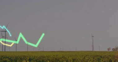 Sarı ve mavi çizelgelerle dalgalanan yeşil çizgi rüzgar çiftliği trendlerini görselleştiriyor. Yenilenebilir enerji, sürdürülebilirlik, çevre, teknoloji, yenilik, kırsal alan, modern