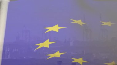 Rüzgârın AB bayrağını kaldırması, dalgalanan sarı yıldızlar ve sislerin arkasında liman vinçlerini ortaya çıkarması. Vatanseverlik, küreselleşme, aktivizm, endüstriyel, kentsel, minimalist, hareket