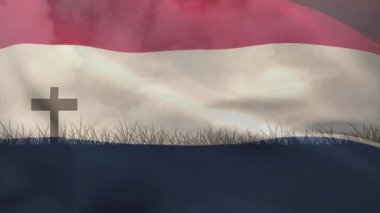 Rüzgâr hızlanıyor, bayrağın kırmızı şeridi dalgalanıyor, beyaz kabarık, mavi çim ve haç üzerinde dalgalanıyor. Vatanseverlik, milliyetçilik, açık hava, hareket, kumaş, sembolizm, manzara