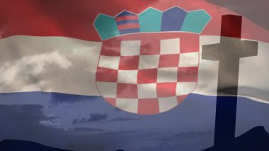 Alacakaranlık geldiğinde, Hırvat bayrağı bulutların, tepelerin ve haçların üzerinde dalgalanarak ulusal mirası onurlandırıyor. Vatanseverlik, ulusal gurur, sembolik manzara, alacakaranlık, anma, hareket