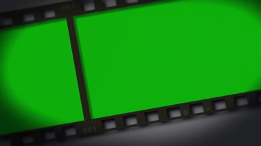 001 film şeridi işaretli panelle başlayarak sola kayarak delikleri ortaya çıkarıyor ve çerçeveleri döngüye sokuyor. Sinematografi, animasyon, minimalist, retro, digital, motion, technology