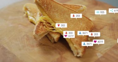 Bir saniyelik sosyal medya simgeleri, artan nişan sayılarını gösteren sandviçler etrafında dolaşmaya başlıyor. Konfor gıdası, dijital müdahale, sosyal medya, teknoloji, aşçılık, kutlama, canlı