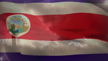 Hafif bir esinti dalgalanan bayrağı başlatıyor ve güneş patlamaları ve bulutlar altında amblemi ortaya çıkarıyor. Vatanseverlik, hareket, kumaş, açık hava, manzara, dinamik, sembolizm