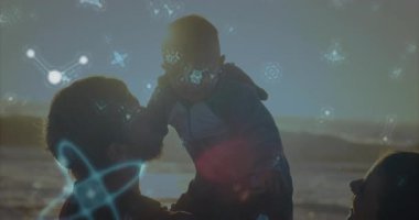 Gün batımında bebek burun kıvırma teknolojisine erişirken orta yaşlı bir adam bebeği yüz yüze kaldırıyor. Aile, bağlantı, sıcaklık, dinginlik, dijital, soyut, boş zaman