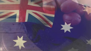 Yakın plan çekimden sonra, Avustralya bayrağı kırmızı patateslerin üzerinde kayboluyor ve başlangıç noktasını vurguluyor. Kırsal, aşçı, minimalist, vatansever, dokulu, doğal, yerel