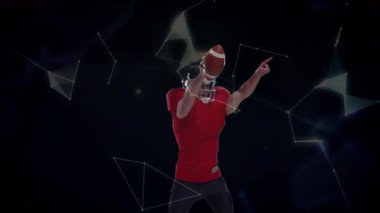 Futbolcu pas etkinleştirme ağı için kaldırıyor. Dünya 'nın sporda kask kayışını ayarladığını gösteriyor. Sporcu, spor, teknoloji, dijital, gelecek, güç, rekabet