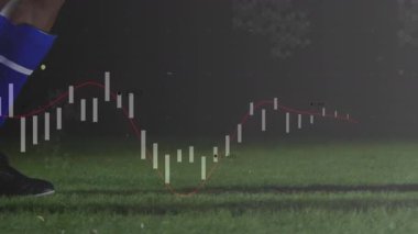 Futbolcu topu alıyor ve onu spor analitiği dalgalanmalarla kontrol etmek için vuruyor. Atletik, performans, çeviklik, kararlılık, spor, dijital, hareket