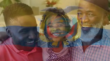 Aileye şeffaf bayrak dalgalanması ve oturma odasındaki birliği gözler önüne sermek. Aile, birliktelik, ev, portre, sıcaklık, bağlantı, uyum.