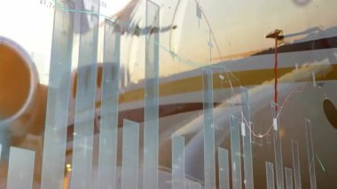 Kanat silueti görünürken, motorun etrafında yükselen ve zikzak çizen veri tabloları pazar eğilimlerini gösteriyor. Havacılık, finans, analitik, soyut, teknoloji, ulaşım, büyüme