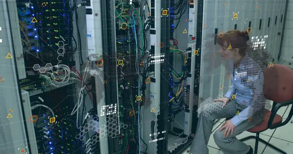 Data processing over globe and world map against caucasian female enginner working at server room. Computer interface and business data storage technology concept