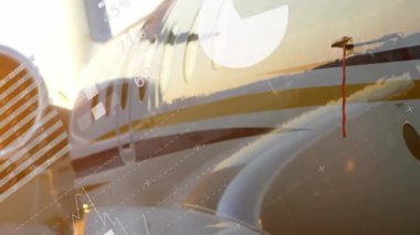 Gün doğumunda parlayan kadranlar ve bar grafikleri jet gövdesi girişinde turta grafiklerine dönüşüyor. Lüks, teknoloji, uzay, havacılık, veri görselleştirme, şirket, iş