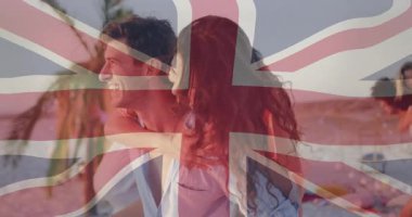 Adam, sahil boyunca, şeffaf Union Jack 'in altında kayarak seyahat eden bir kadına boyun eğiyor. Romantizm, eğlence, kutlama, macera, tatil, yaşam tarzı, manzara