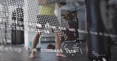 Spor salonuna giren bir adam dünya haritasının nabız kodlarıyla duruş alıyor yumruk atma alıştırması yapıyor. Fitness, training, fight, digital, technology, strength, determination