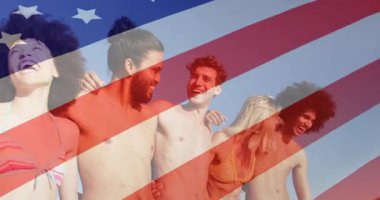 Sandy Plajı 'nda kol kola giren altı kişilik bir grup Amerikan bayrağı pazarlama için soluyor. Gençlik, dostluk, kutlama, açık hava, coşku, birlik, eğlence.