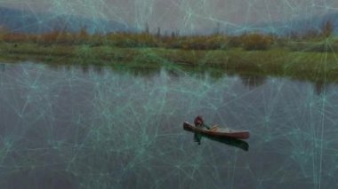 Tekli kanocu, göl kıyısını teknolojide sürüklenen ağ hatlarıyla keşfetmek için raket vuruşları yapıyor. Yalnızlık, sükunet, yansıma, vahşi doğa, keşif, sükunet, soyutlama