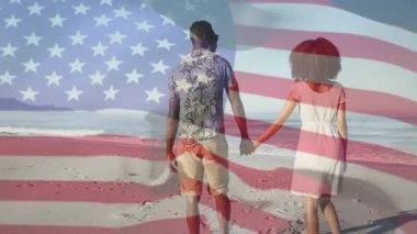 Kumsalda el ele yürüyen bir çift, bayrak gibi dağlanan ticari markalar sergiliyorlar. Vatanseverlik, dinginlik, rahatlık, tatil, açık hava, uyum, basitlik