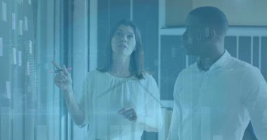 Çeşitli iş adamları üzerinde finansal veri işleme ve rüzgar türbininin görüntüsü. Küresel iş, bilgisayar ve dijital arayüz kavramı dijital olarak oluşturulmuş görüntü.