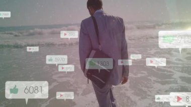 Business-casual man stepping into surf causing social media notification bubbles rising then fading. Beach, lifestyle, minimalist, digital, leisure, tranquility, landscape