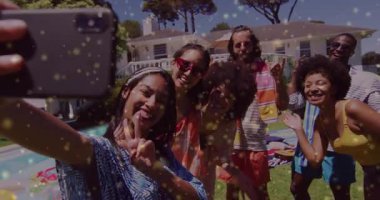 Woman extending smartphone causing sparkle over friends by pool for social-media selfie review. Vacation, leisure, summer, lifestyle, happiness, candid, vibrant