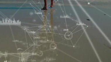 When digital network graphics overlaying feet, woman stepping into surf illustrating data flow. Technological, futuristic, organic, minimalist, aquatic, connection, innovation