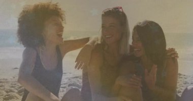 Three friends bonding through laughter on sunny travel beach while center friend wearing sunglasses. Cohesion, relaxation, camaraderie, sunlit, leisure, natural, joyful