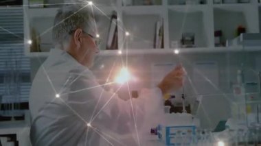 Senior researcher reaching pipette, preparing sample for lab testing while network overlay pulsing. Science, innovation, precision, technology, laboratory, research, analytics