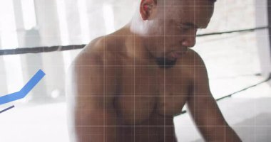 Boksör eldiven sıkıyor, köşede ter siliyor ve performans verilerini grafikler yükseldikçe gözden geçiriyor. Sporcu, fitness, biyomekanik, performans, eğitim, profesyonel, dijital